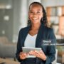 Portrait, lawyer and black woman with tablet, smile and happy in office workplace. African attorney, technology and face of professional, female advocate and legal advisor from Nigeria in law firm.