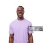 young positive american man in lilac t-shirt smiling on white background.